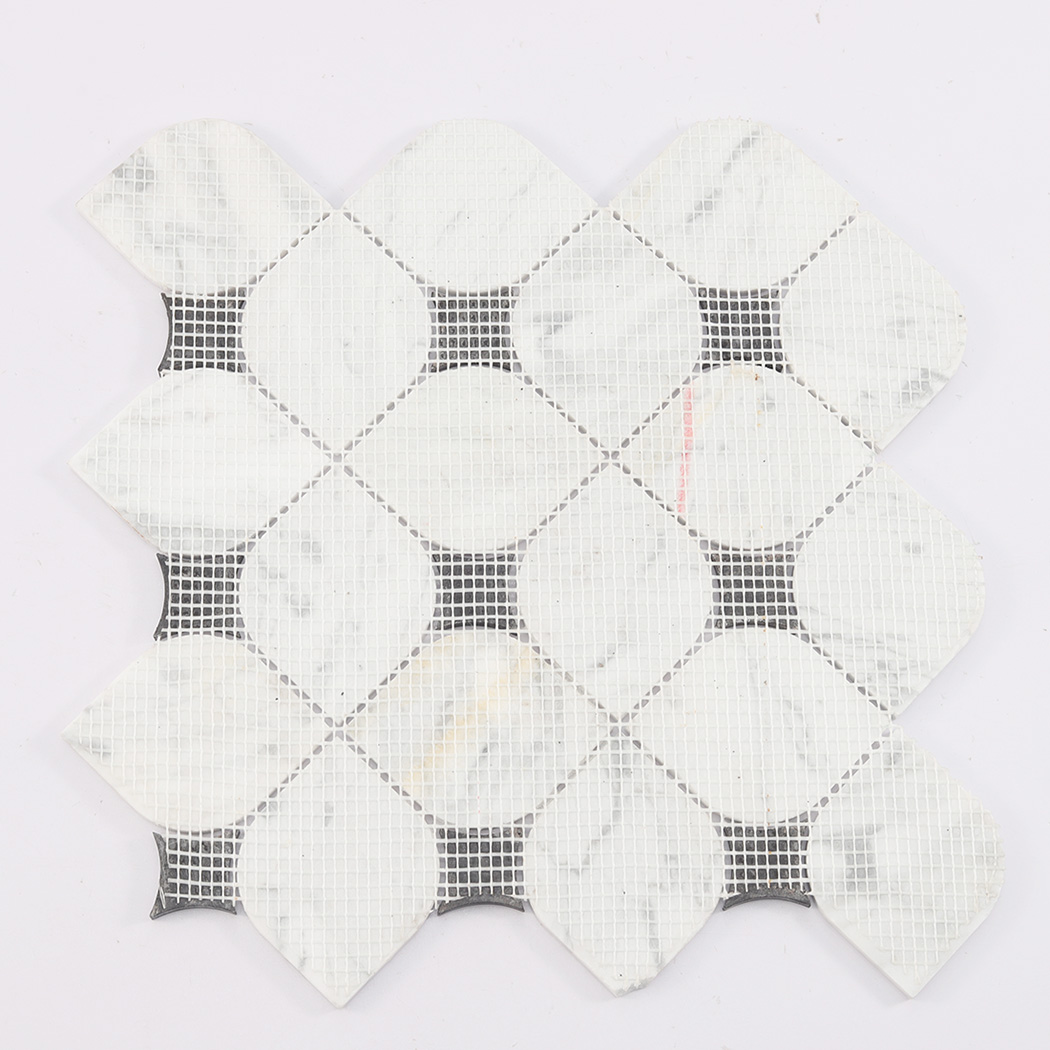 Back view of white marble mosaic tile sheet with mesh backing and black inserts