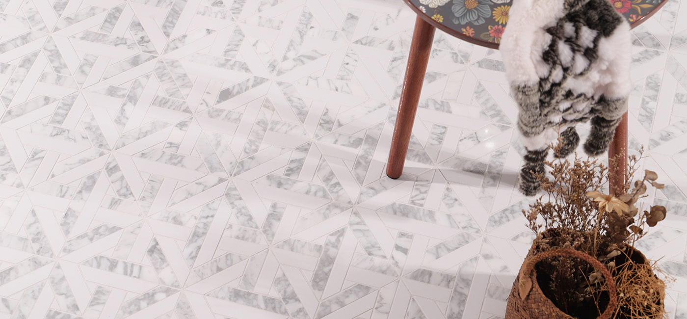 Wide view of geometric white marble mosaic tile flooring