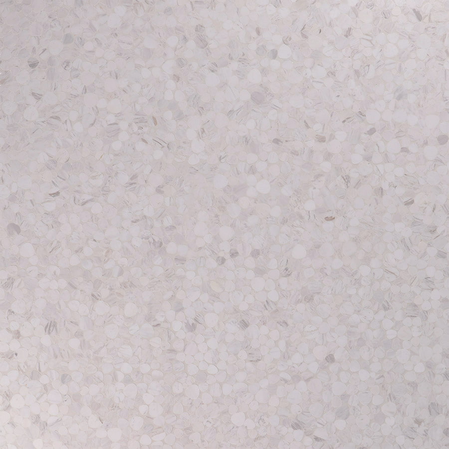 Close-up of white marble pebble mosaic tiles with smooth texture