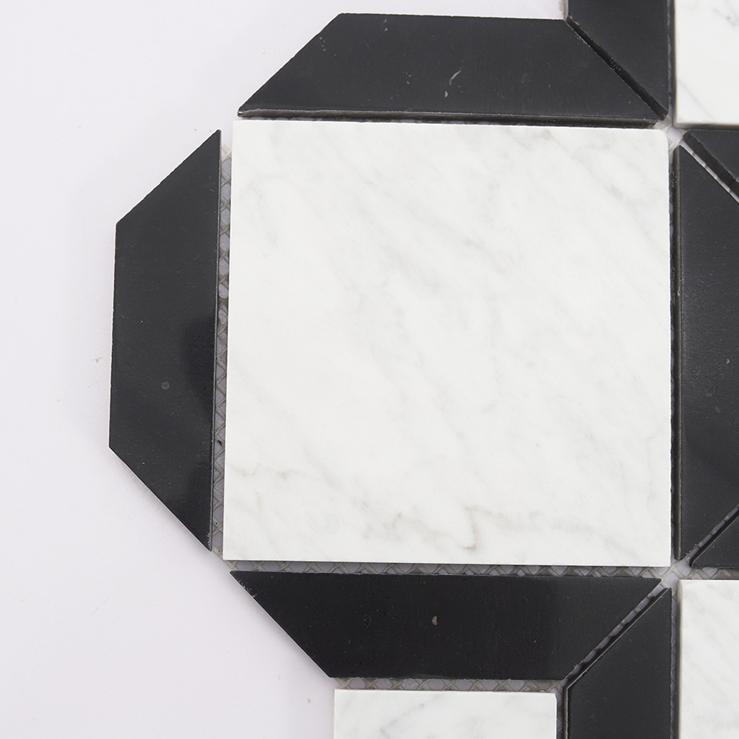Close up of white marble rectangle tile with black border pieces