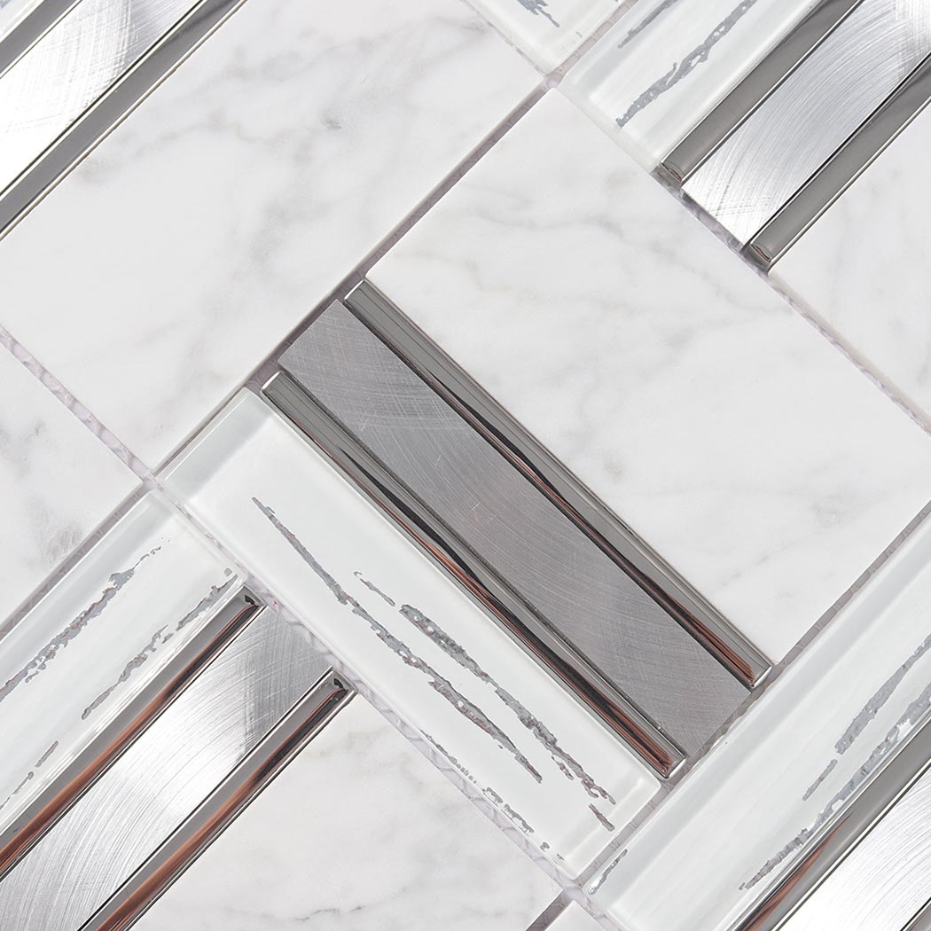White marble tile surface with brushed silver metal inserts and gray veining