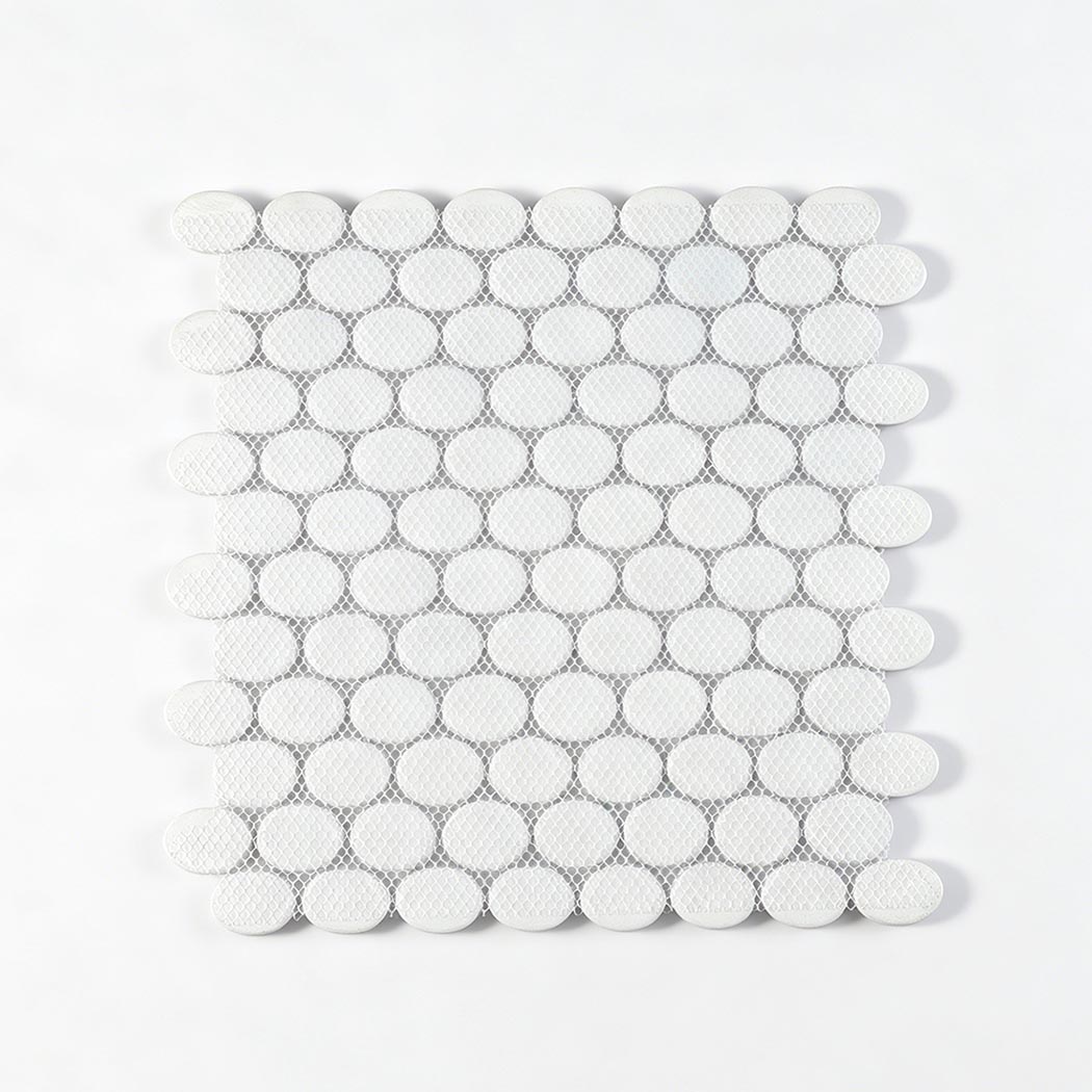 Back view of oval glass mosaic tile sheet with white mesh mounted backing