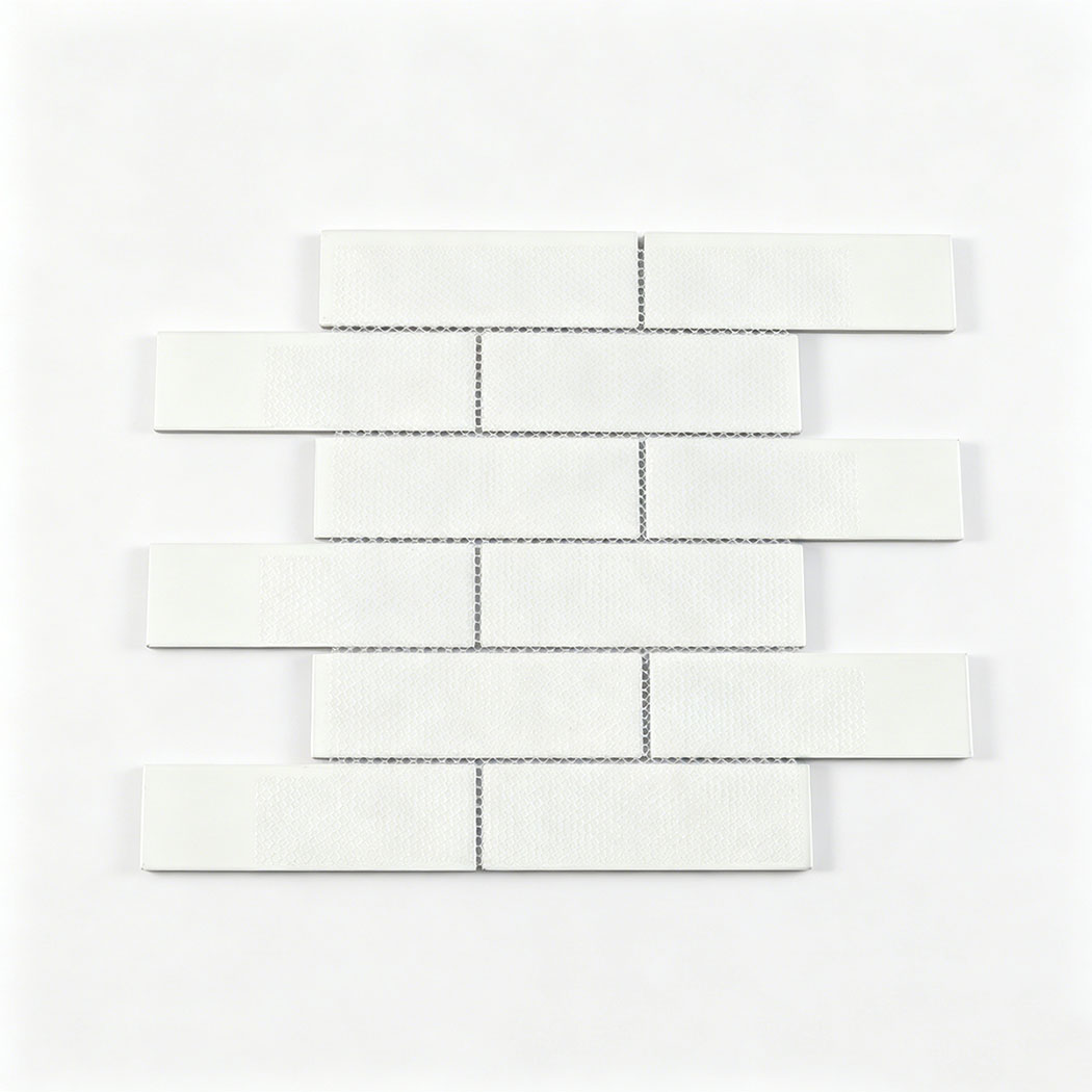 White mesh backing on brown glass subway tile sheet for wall installation