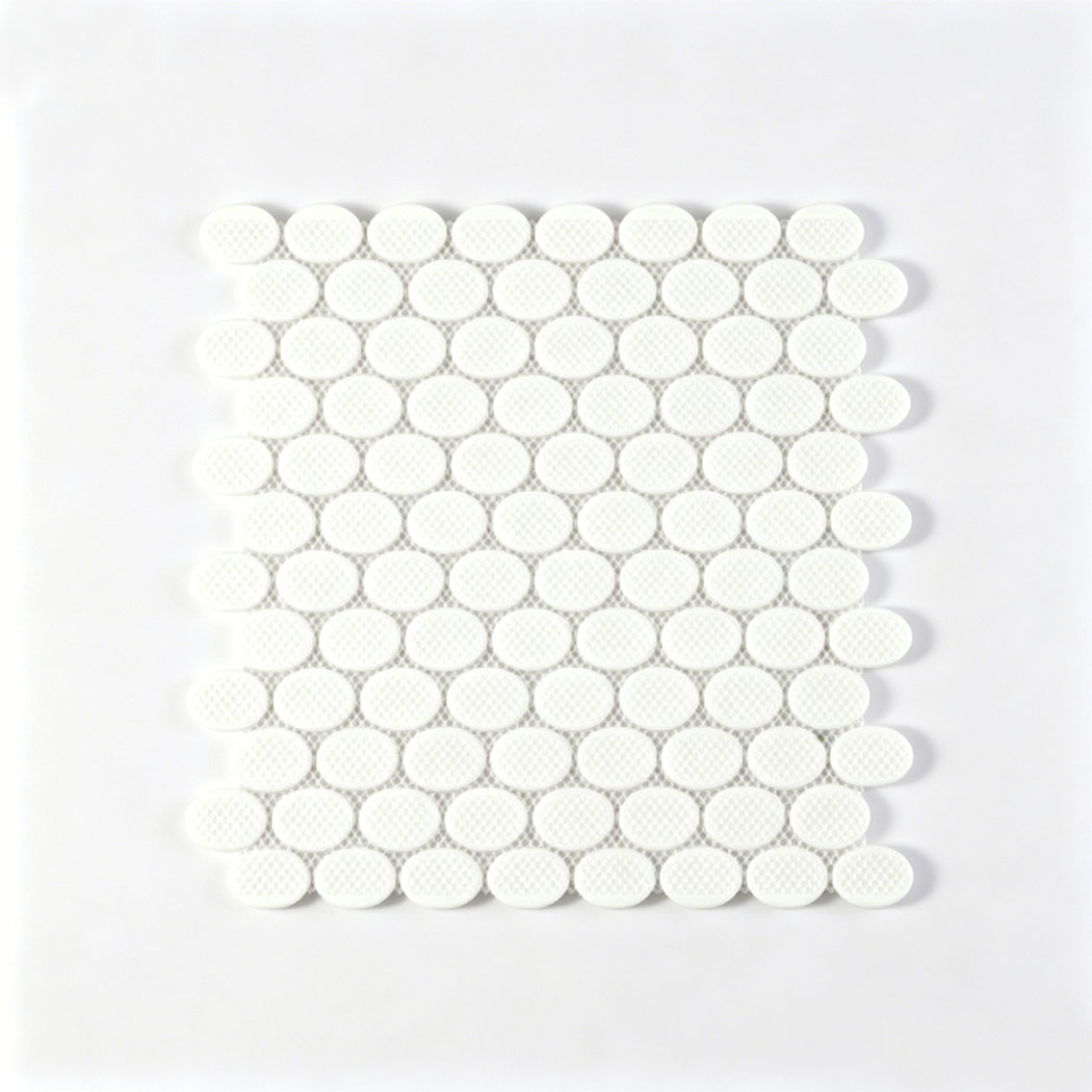 Back view of oval glass mosaic tile sheet with white mesh mounted backing