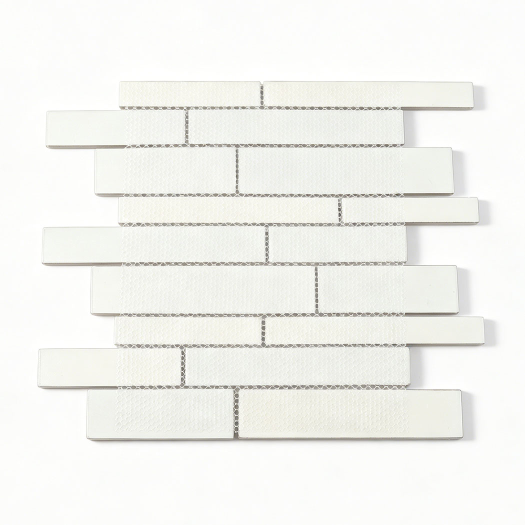 Back view of gray linear glass mosaic tile sheet with white mesh mounted backing