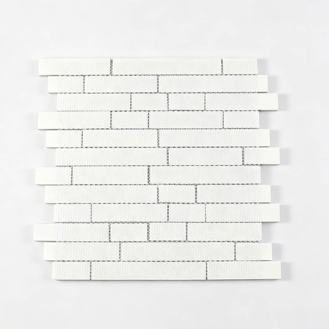 Back side of aqua linear glass mosaic sheet showing white mesh mounting
