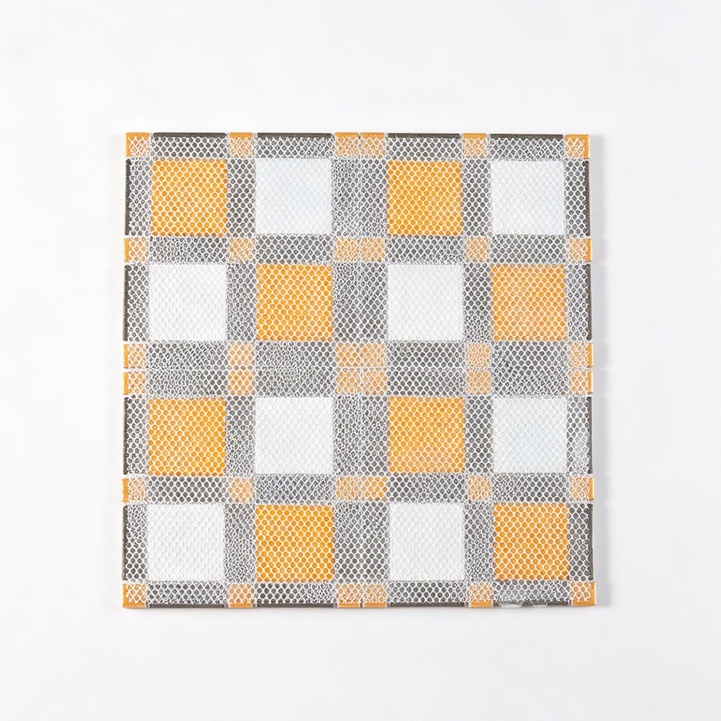Back view of square mosaic tile sheet with white mesh mounted backing