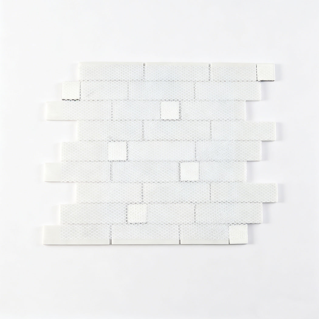 Back view of white marble subway mosaic tile sheet with mesh mounted backing