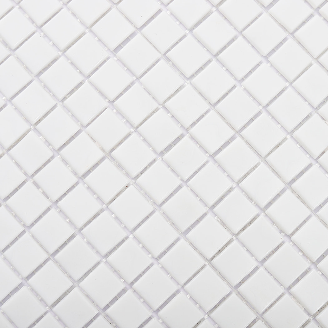 Diagonal close-up view highlighting the smooth finish of white mosaic glass tiles
