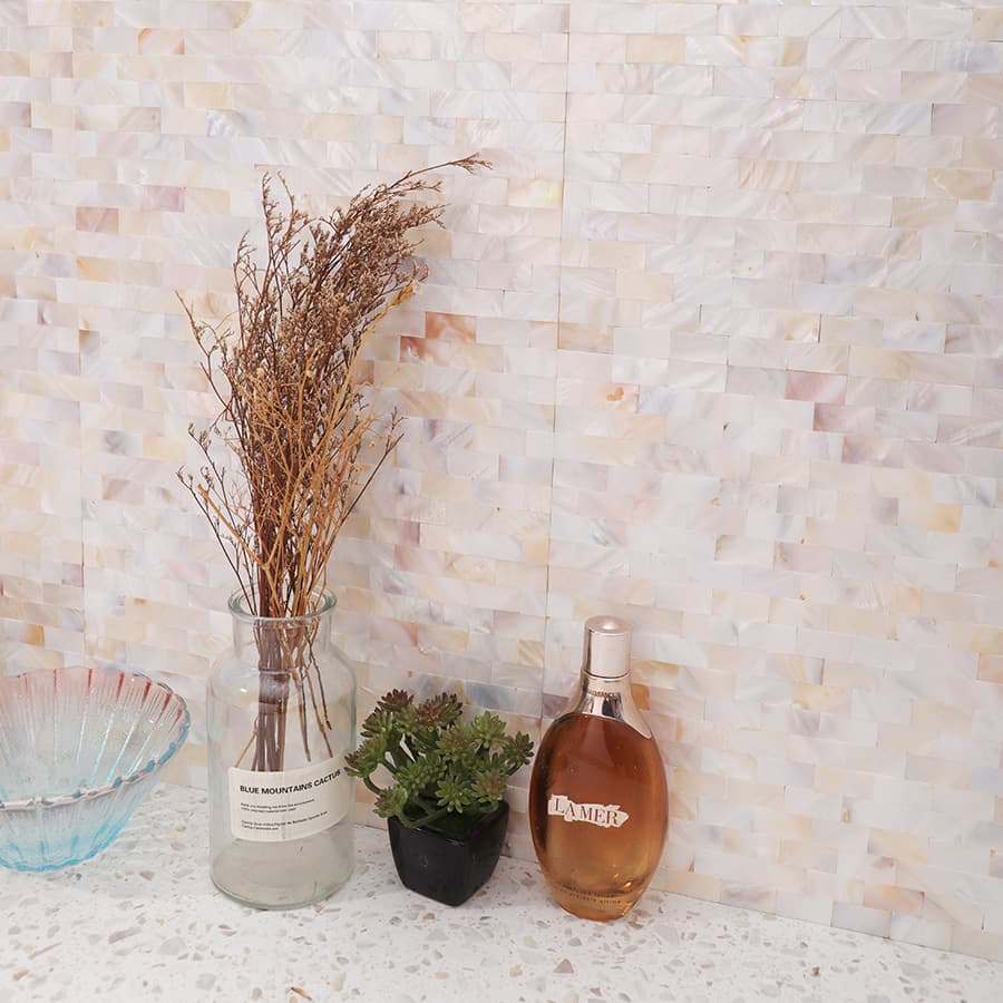 White mother of pearl tile backsplash with home decor
