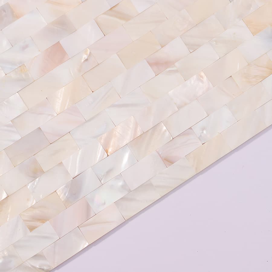  Side close-up view of white mother of pearl subway tile