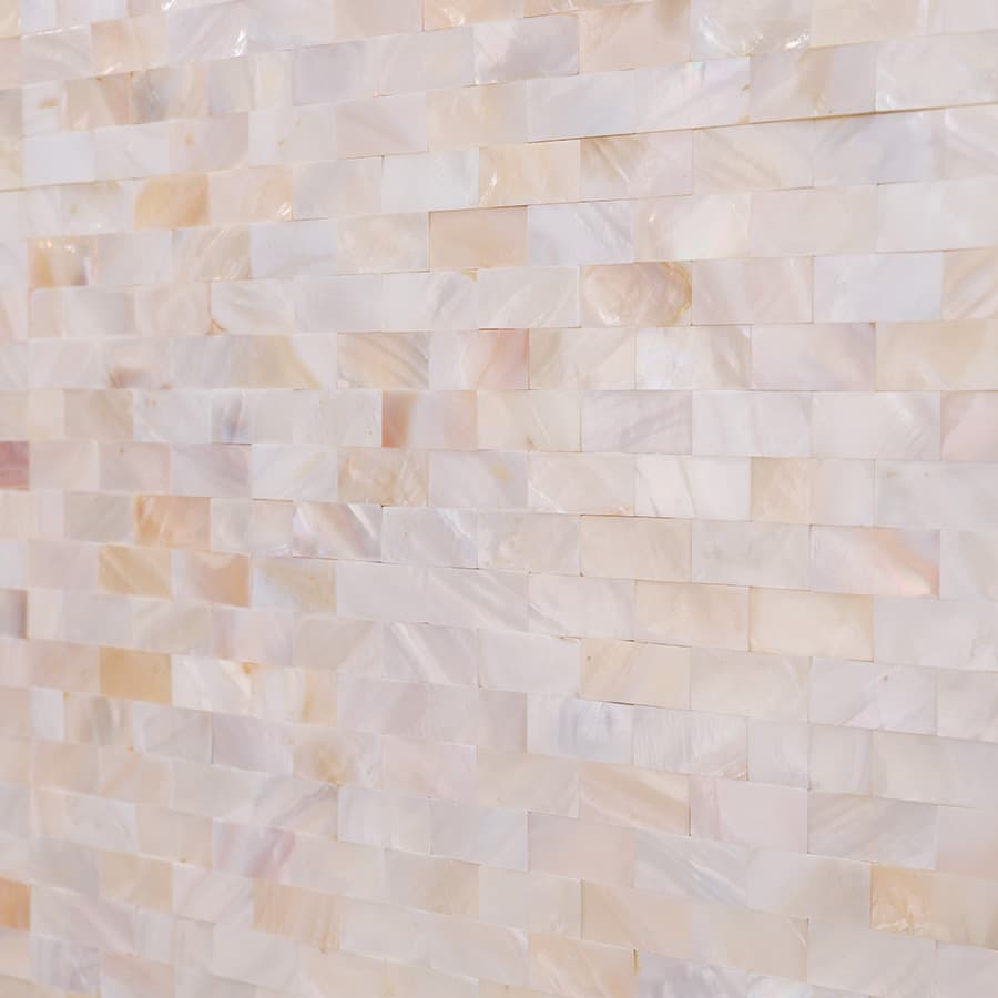 Surface detail of tight joint white mother of pearl tiles