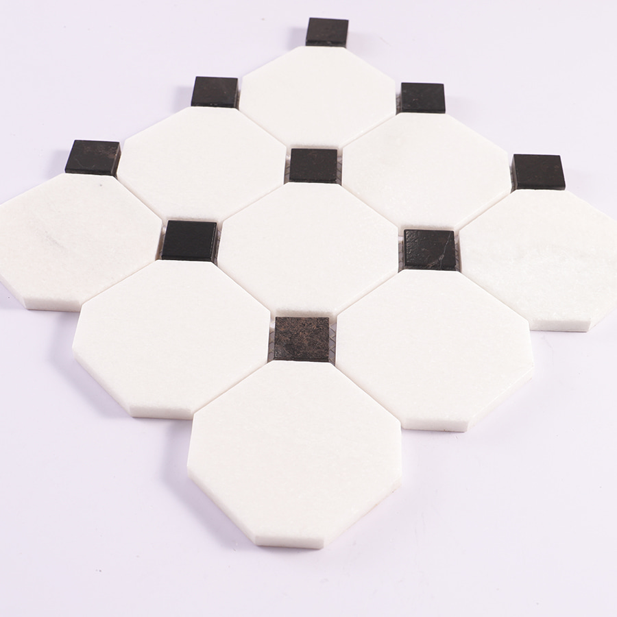 Angled view of white octagon marble mosaic with black square accents