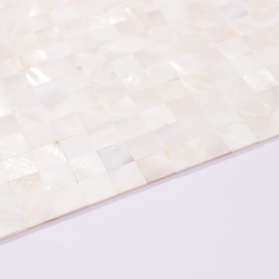 Close-up of edge detail on white shell mosaic tile