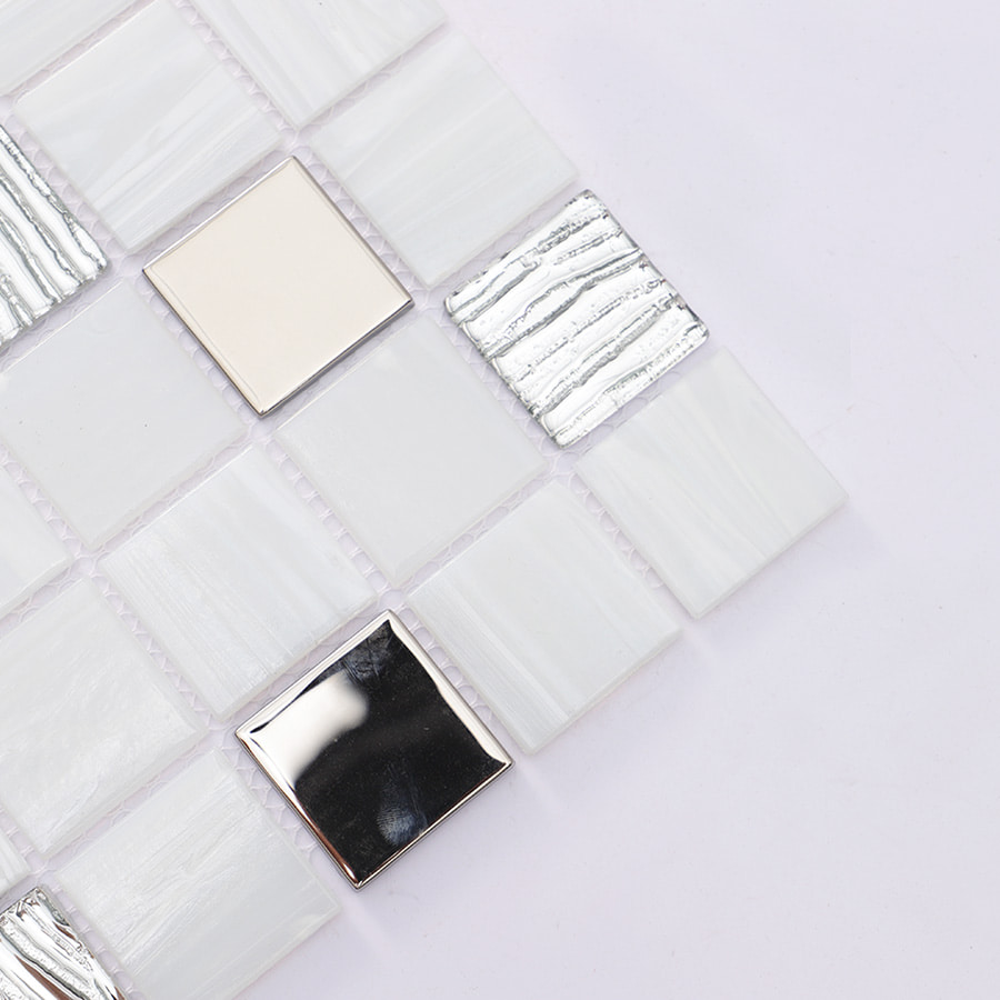 Close up of mosaic tile corner showing metallic and textured tiles