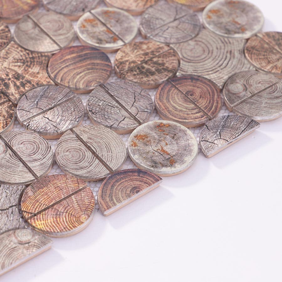 Angled close-up view of edge finish on wood grain aluminum mosaic