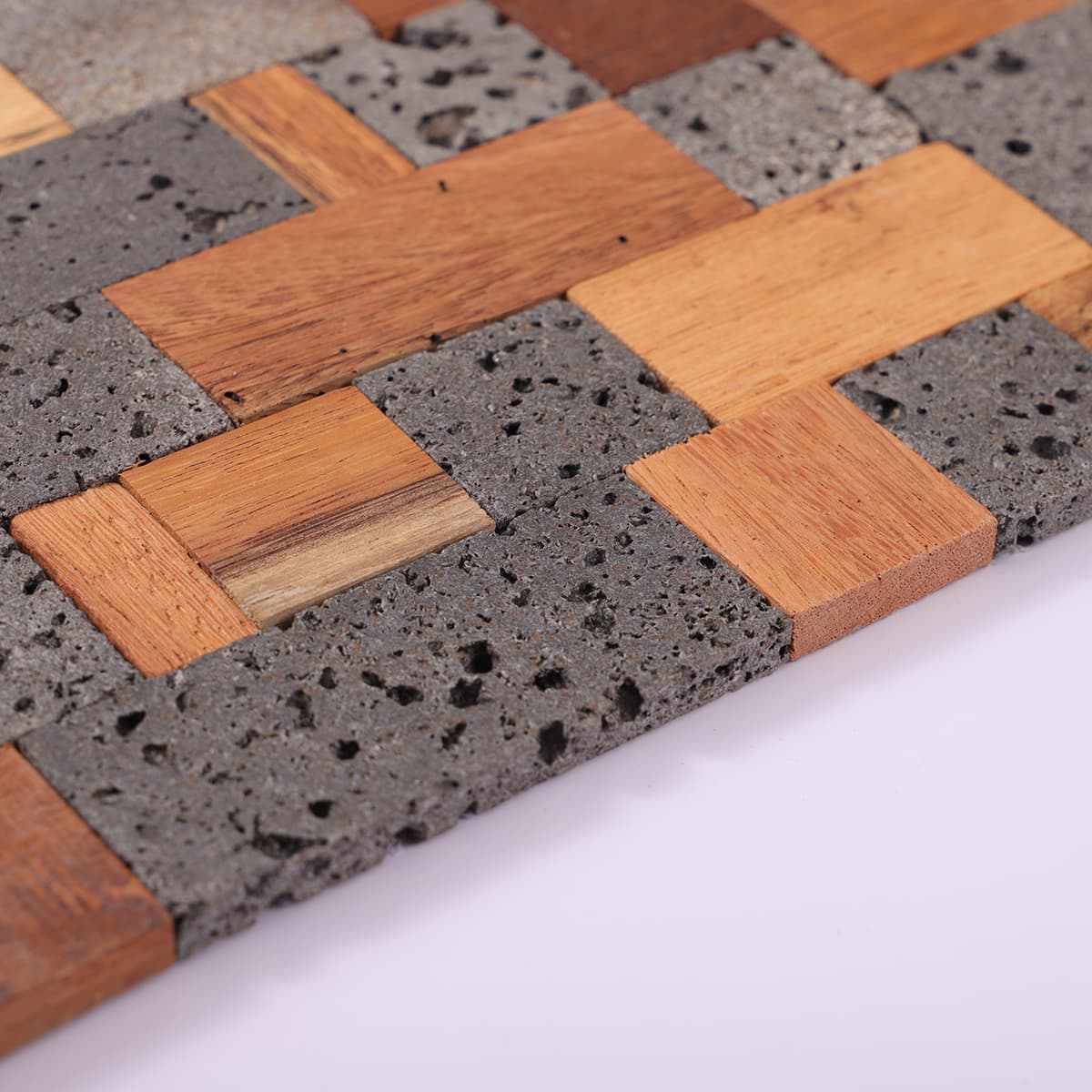 Edge view of wood and lava stone mosaic tile