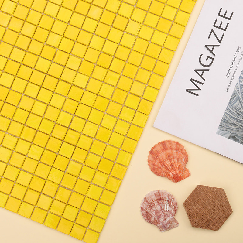 Yellow 15mm glass mosaic tile sheet with seashells and lifestyle magazine