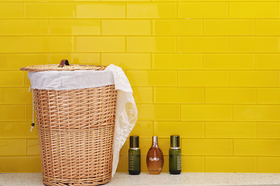 Yellow kitchen tiles in a glossy glass subway style for a bright, modern backsplash.