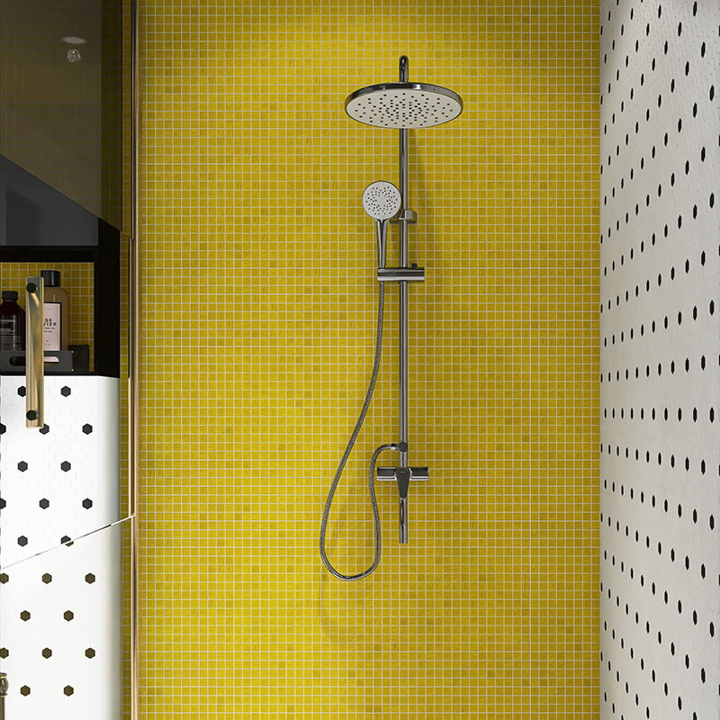 Modern shower with small yellow mosaic tiles and sleek fixtures