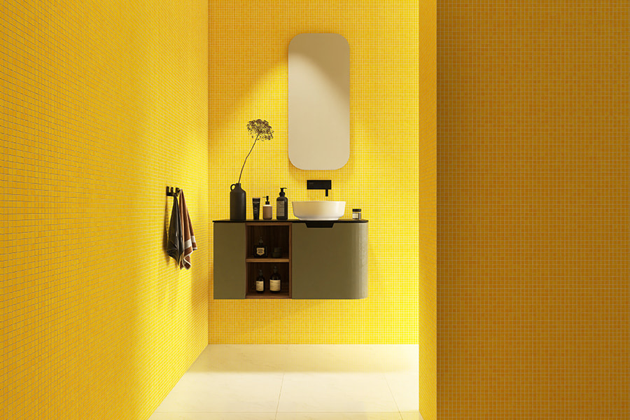 Yellow mosaic tiles with wall-mounted vanity and oval mirror
