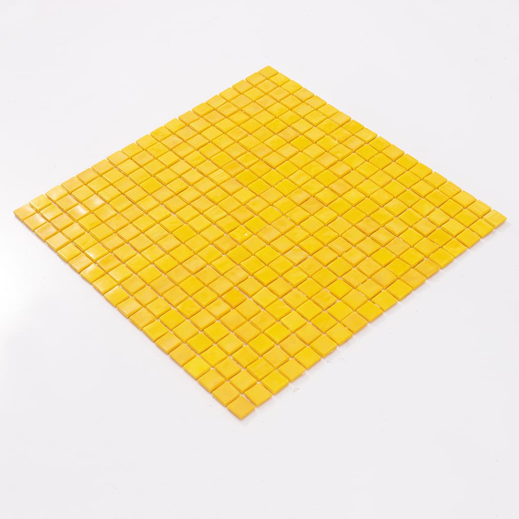 Angled full sheet view of yellow square glass mosaic tile