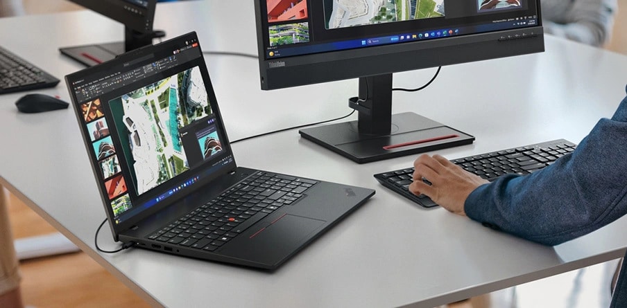 Lenovo ThinkPad T16 Gen 3 (16" Intel) laptop — in use on a desk with a Lenovo monitor and cordless keyboard/mouse