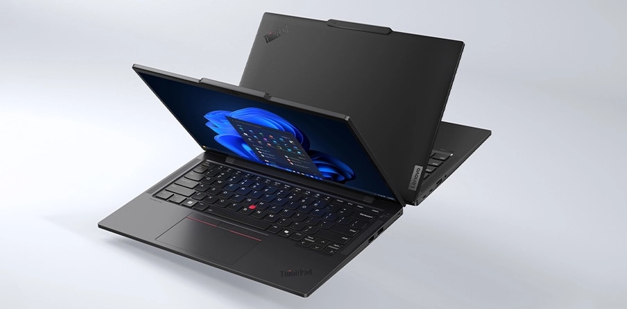 Two Lenovo ThinkPad T14s Gen5 (14&rdquo; Intel) Eclipse Black laptops opened at acute angle placed back to back with one showing its front right side view & a Windows 11 Pro menu on its screen.
