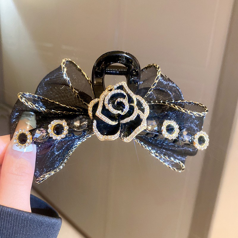 黑色山茶花蝴蝶結髮夾