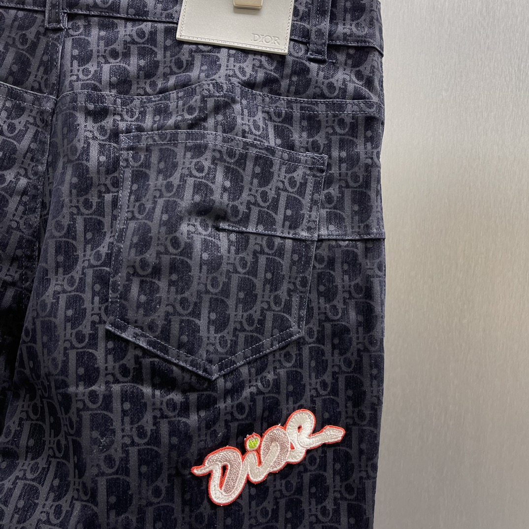 DIOR And Kaws logo print jeans（513D021B321X-C584）