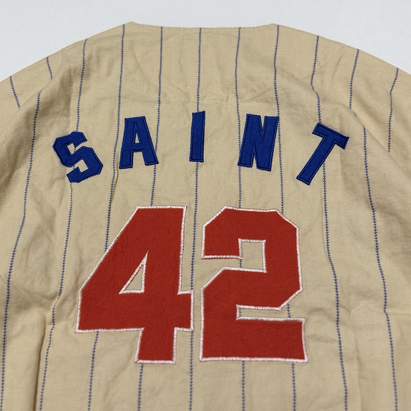 SAINT MXXXXXX Pinstriped Baseball Shirt (SMMK80000039）