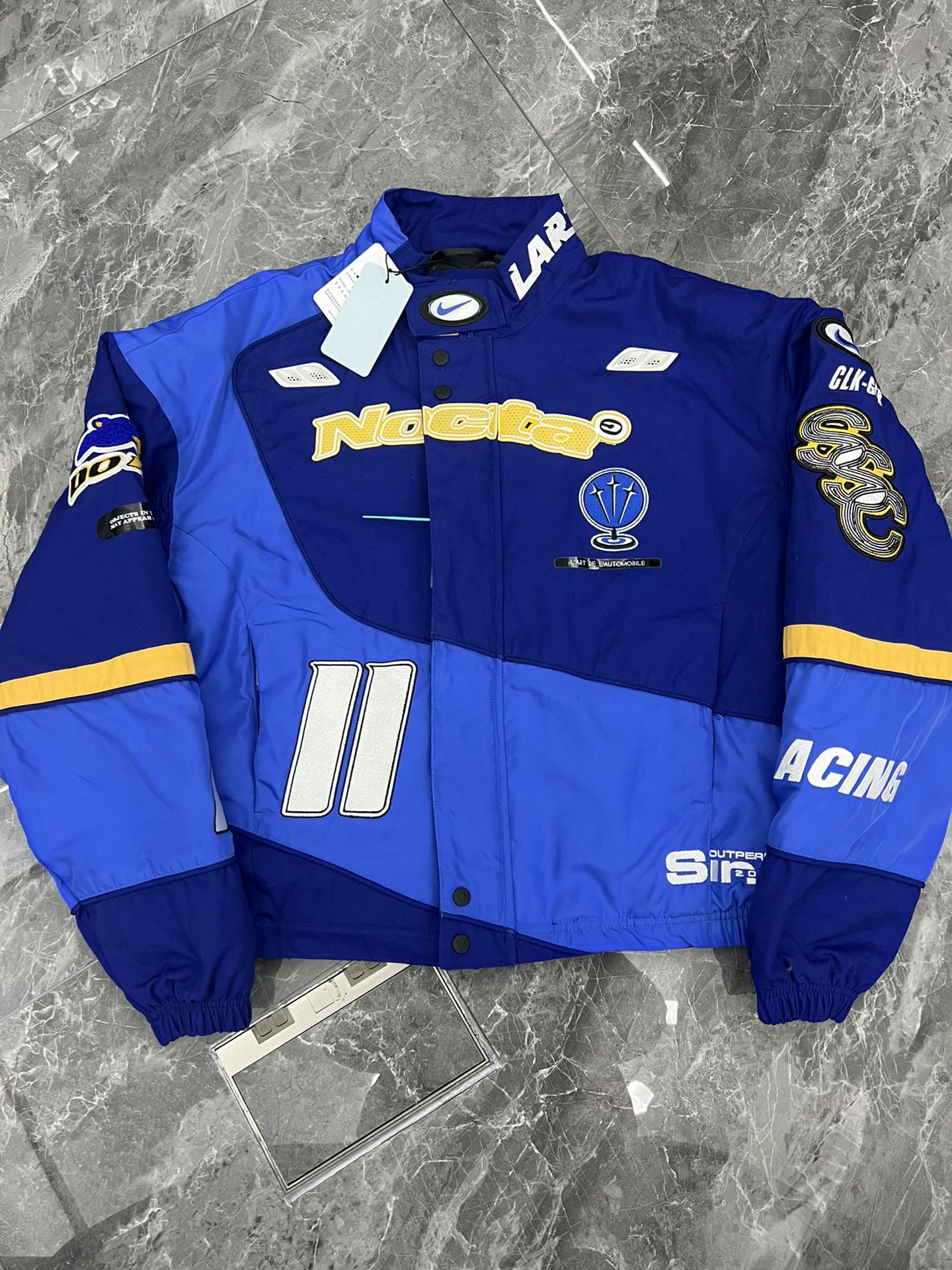 Nike x NOCTA L'Art Racing Jacket (FD2195-455）