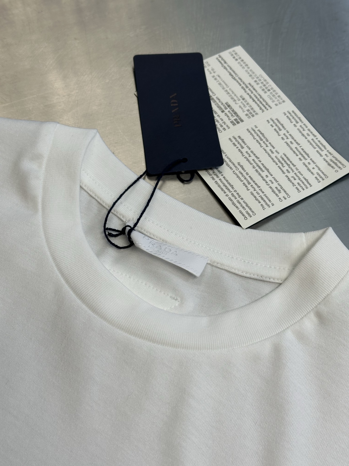 Prada printed cotton T-shirt (UJN972-1851-F0963-S-OOO）