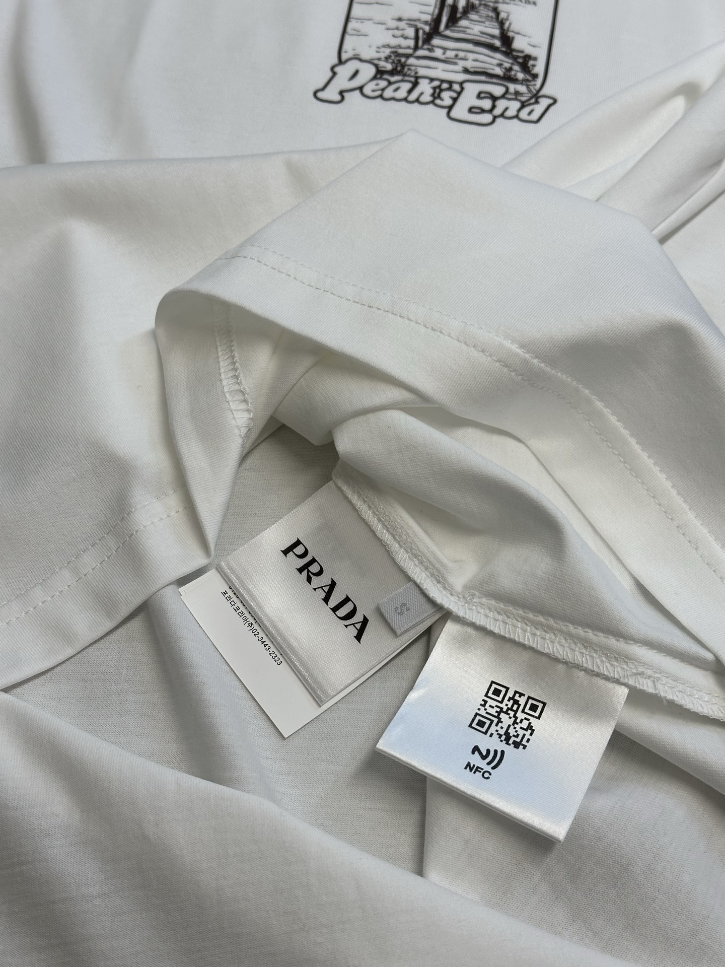 Prada printed cotton T-shirt (UJN972-1851-F0963-S-OOO）