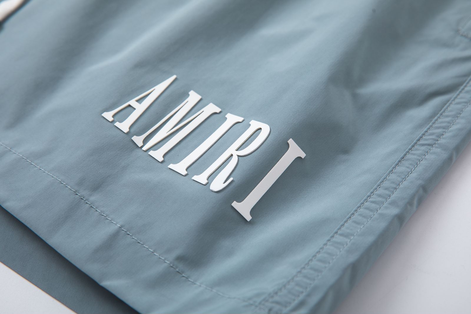 AMIRI CORE LOGO SWIM TRUNKS (PXMJP0029001)