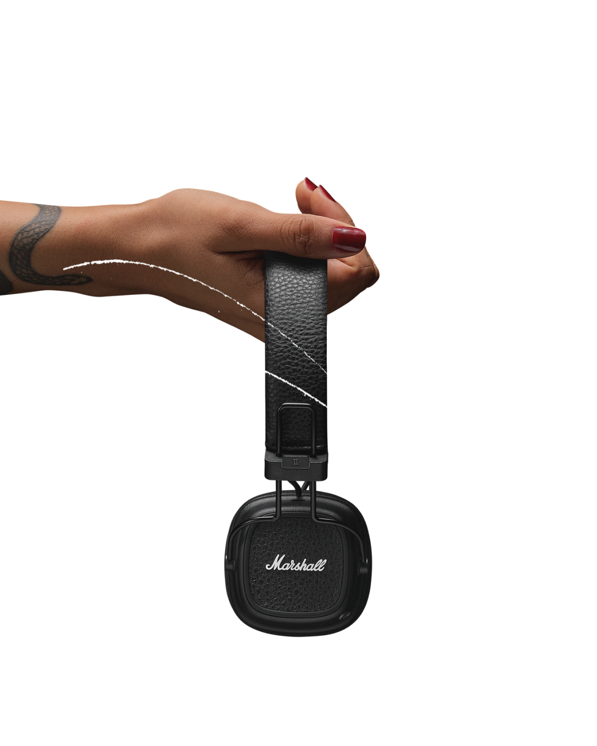Woman holding a pair of Marshall Major V Black on-ear headphones.