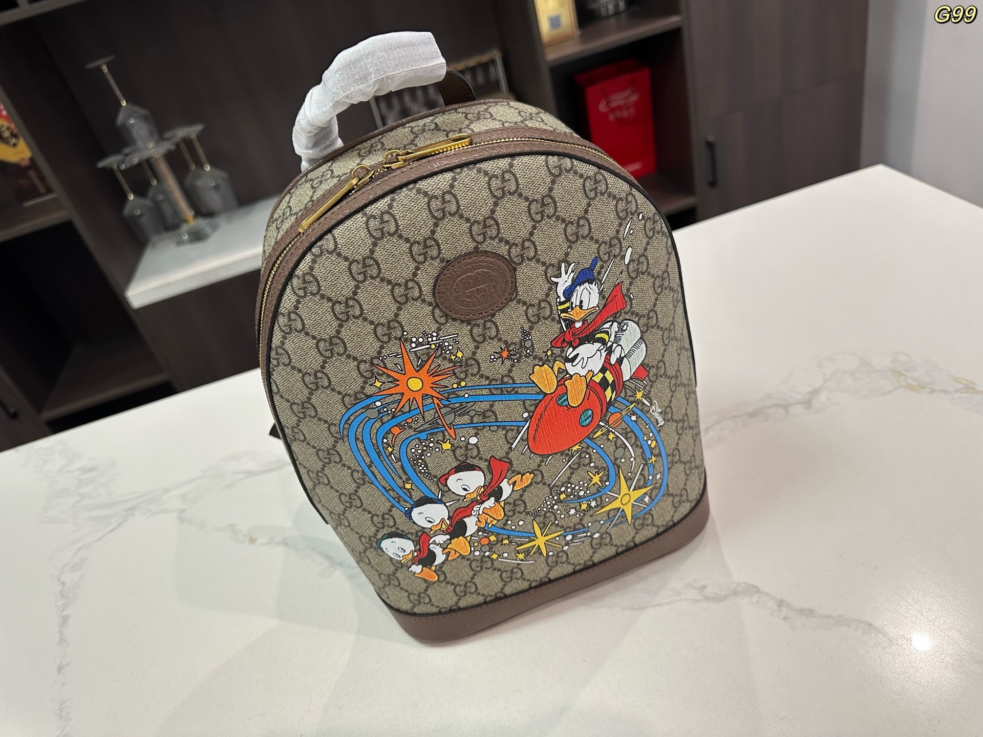 Gucci Disney コラボレーションシリーズ ドナルドダックGGプリントバックパック 30*22cm ユニセックス リュックサック