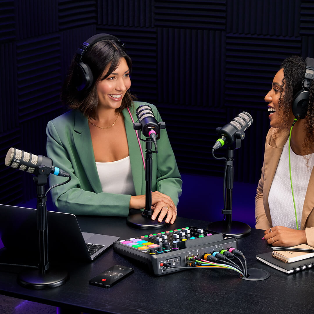 Two people recording podcast with PodMics mounted to DS1s  and using R&Oslash;DECaster Pro II