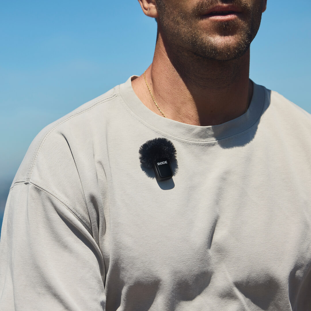 White Wireless Micro transmitter clipped to shirt