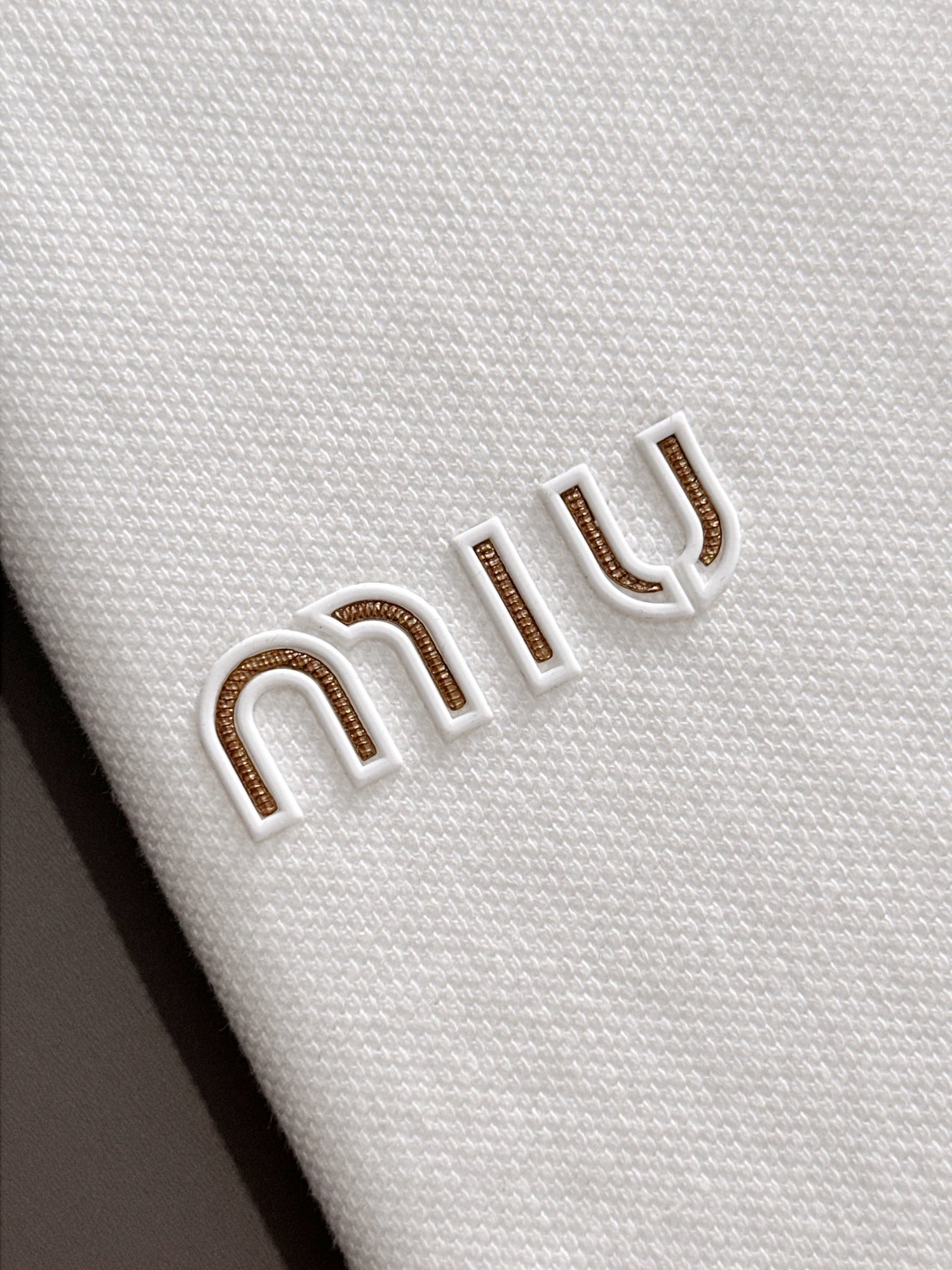 MIU MIU 2025年春夏新作 ネイビー/ホワイト ポロシャツ 半袖 T138063