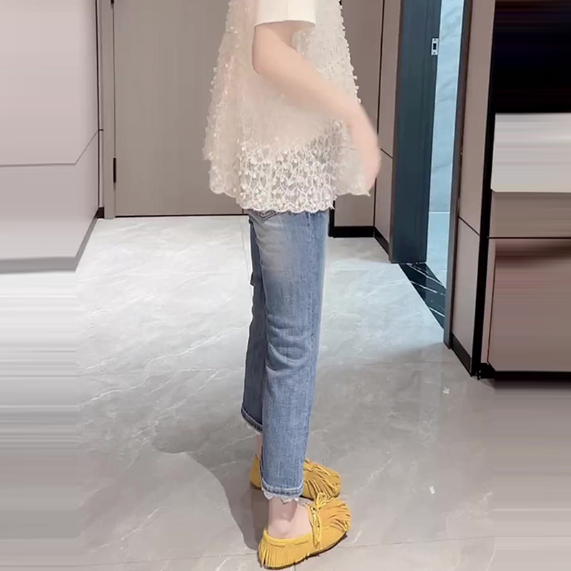 拼接蕾絲九分微喇叭牛仔褲