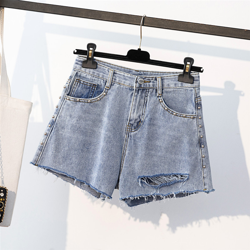 新款高腰破洞釘珠毛邊牛仔短褲