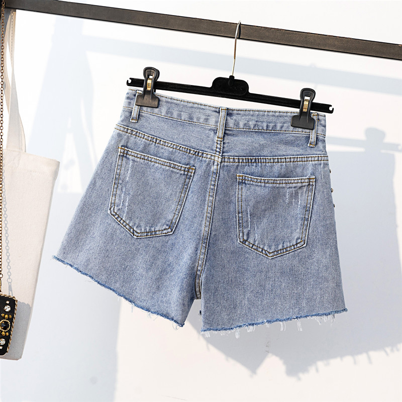 新款高腰破洞釘珠毛邊牛仔短褲