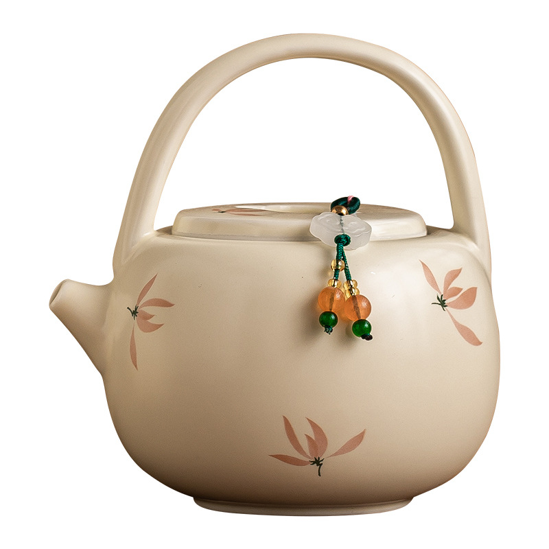 米黃釉蘭花提梁壺