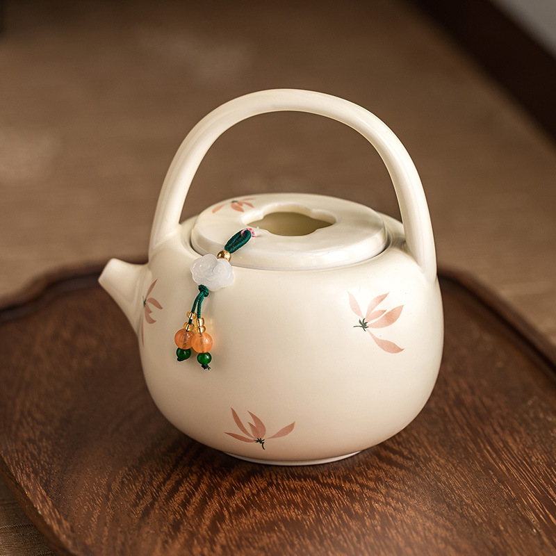 米黃釉蘭花提梁壺