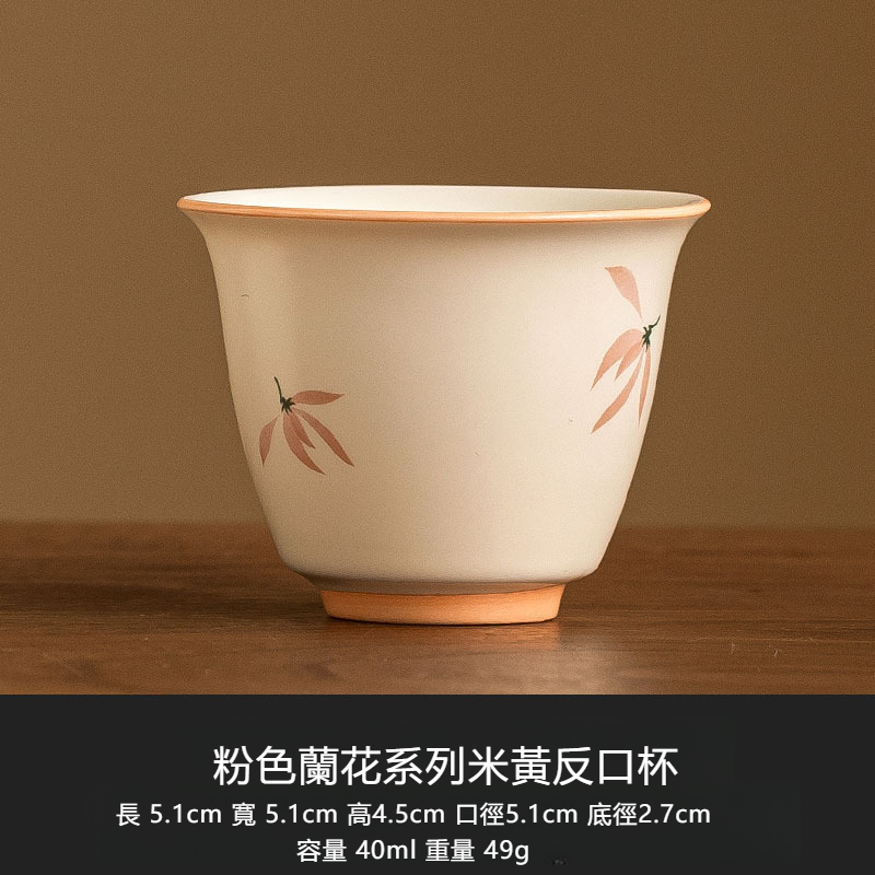 米黃釉蘭花綁繩提梁壺