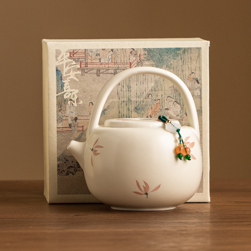 米黃釉蘭花提梁壺