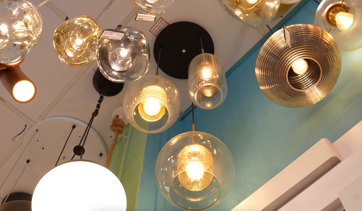 Close-up of decorative pendant lights hanging from a ceiling