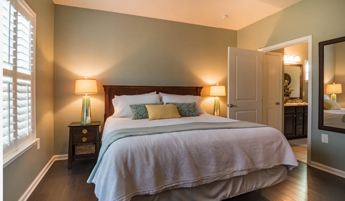 Warm bedside table lamps in a cozy bedroom, enhancing relaxation with soft ambient lighting.