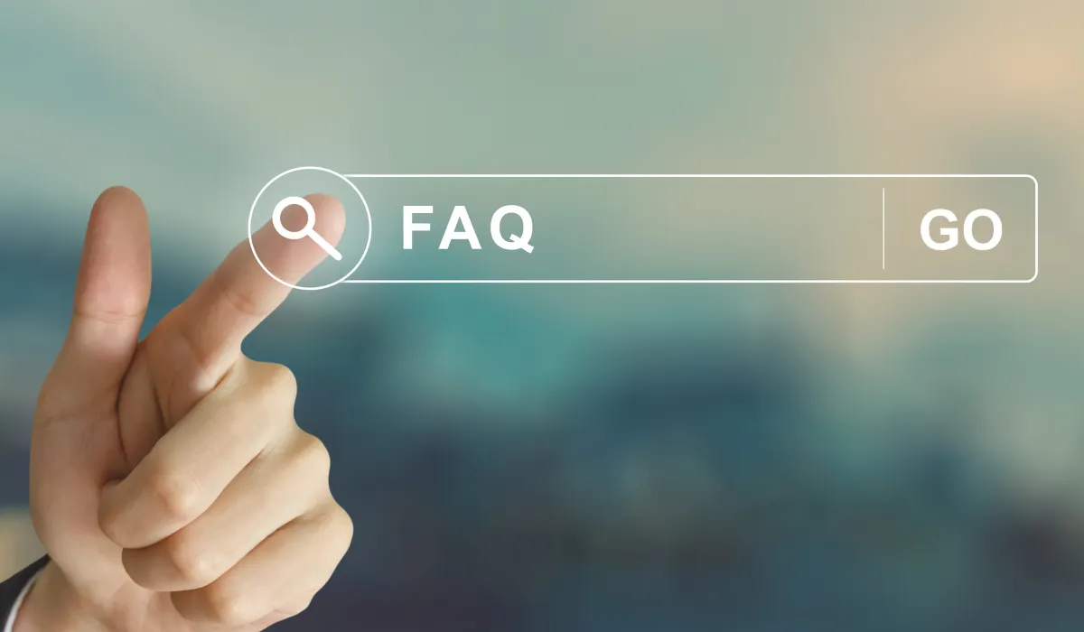 Search bar with 'FAQ' text and a pointing finger selecting the search option.
